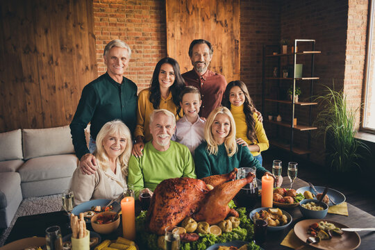 Portrait Of Nice Adorable Careful Cheerful Family Small Little Kids Meeting Enjoying Celebration Tradition Hugging Eating Domestic Turkey At Modern Loft Industrial Brick Interior House