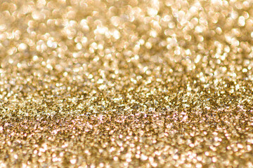 Abstract gold background with copy space. Glitter and bokeh. Christmas and new year concept