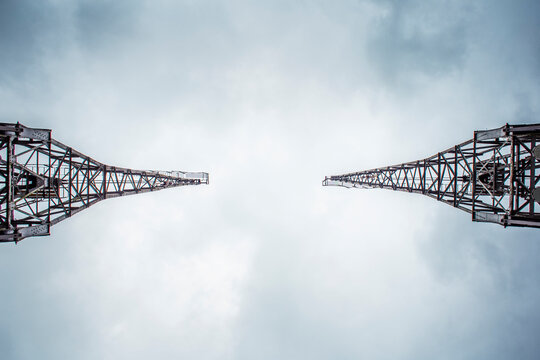 View Of The Abandoned Cranes In The Bristol Harbour, Uk. Dark And Dramatic Sky On The Background. View From The Bottom.