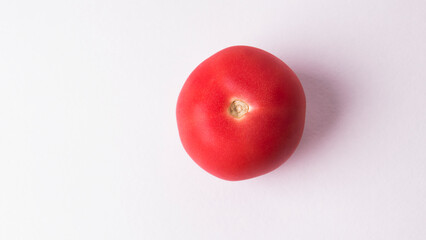 One tomato isolated on white background. Fresh red tomato with clipping path