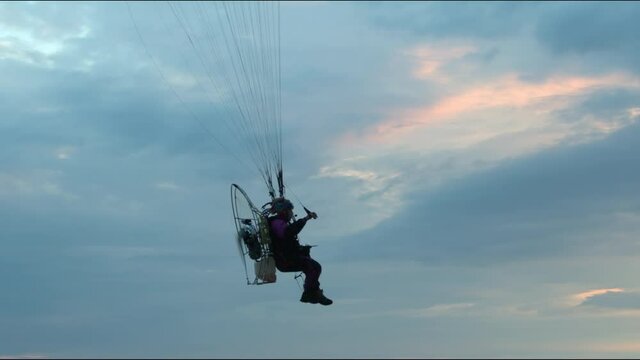 Paraplan in the evening sky