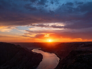 Fototapeta na wymiar Beautiful sunset on the river. Ili River in spring. Kazakhstan. Almaty Region
