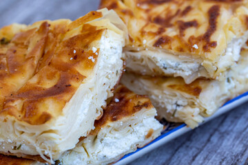 Su Boregi / Turkish Patty on wooden surface.