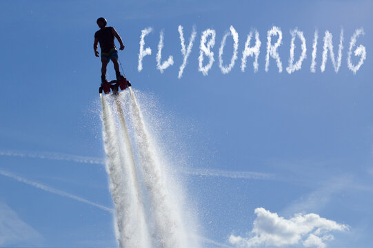Man posing at new flyboard - the inscription "flyboard"