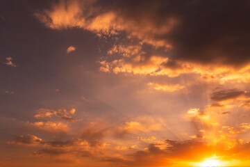 Beautiful bright sunset sky. Dramatic colorful clouds after sunset. Nature, sunset clouds backgrounds.