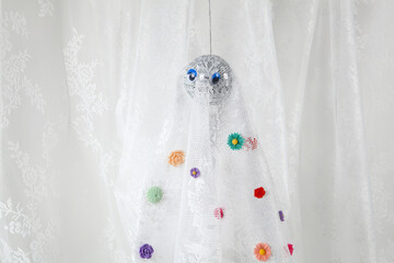 ghost in lace curtain with flowers