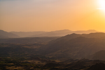 Beautiful sunset landscape. Panoramic view on the mountains on the sunset.