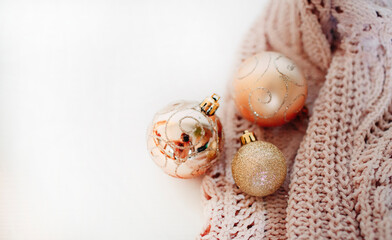 concept of coming holidays such as Christmas and New year presented by golden ornaments balls and sweater