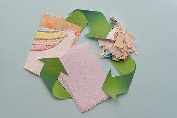 Sheets of paper and a zero waste sign are on the table. Paper recycling concept.