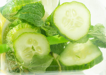Slice of lemon, lime, cucumber. drop into a sparkling carbonated water, a refreshing juice....