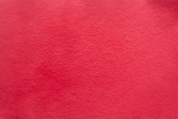 Red Christmas background, handmade paper. Paper recycling concept.