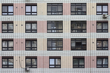 fragment of the facade of a new multi-storey building