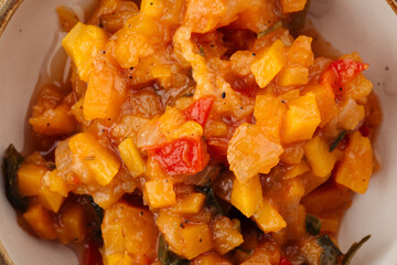 Top view on yellow vegetable ragout sauce 