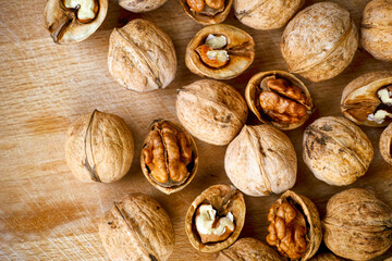 Walnuts on wooden background.