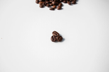 Grains of coffee on a white background. Different shapes made from grains