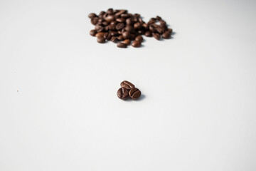 Grains of coffee on a white background. Different shapes made from grains
