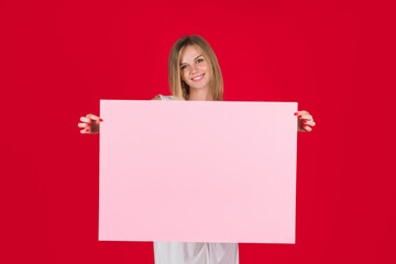 Black friday. Advertising. Advertising board. Smiling woman holds empty advertising banner. Woman shows empty board. Ready for your text. Sale and discount. Season sales.