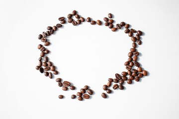 Grains of coffee on a white background. Different shapes made from grains