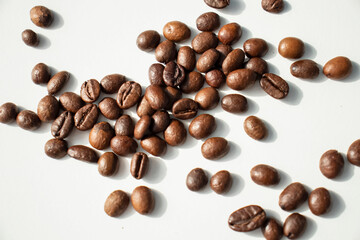 Grains of coffee on a white background. Different shapes made from grains