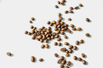 Grains of coffee on a white background. Different shapes made from grains