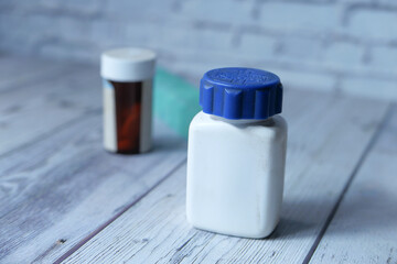 Close up of empty pill container on table 