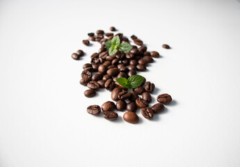 Grains of coffee on a white background. Different shapes made from grains
