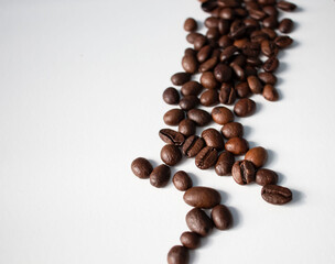 Grains of coffee on a white background. Different shapes made from grains