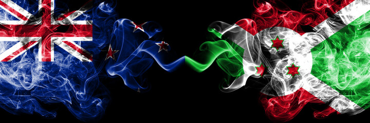 New Zealand vs Burundi, Burundian smoky mystic flags placed side by side. Thick colored silky abstract smoke flags