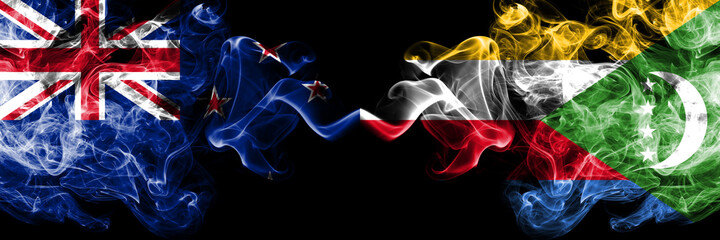 New Zealand vs Comoros, Comorian smoky mystic flags placed side by side. Thick colored silky abstract smoke flags