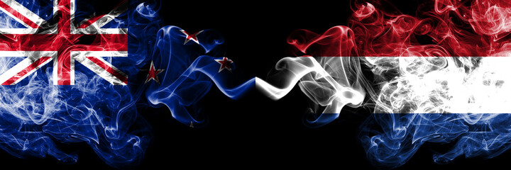 New Zealand vs Netherlands, Dutch smoky mystic flags placed side by side. Thick colored silky abstract smoke flags