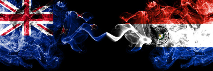 New Zealand vs Paraguay, Paraguayan smoky mystic flags placed side by side. Thick colored silky abstract smoke flags