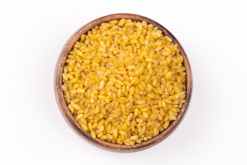 Heap of dry bulgur isolated on white