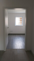 view to clean modern empty room with door and window