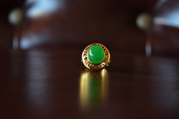 Fototapeta na wymiar Gold ring decorated with green jade