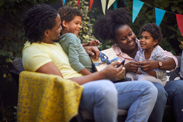 afro-american family at birthday party, sitting together