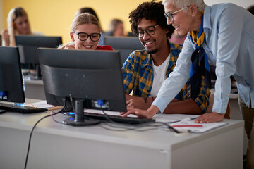 Students learning from a female professor at an informatics lecture