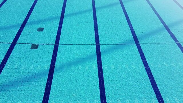 drone shot flying over Costoli empty swimming pool due to Coronavirus pandemic. Florence Campo Marte area near Fiorentina soccer team stadium. Tuscany, Italy
