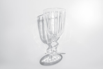 One glass on a white background.