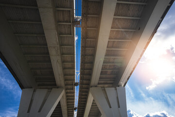 Fototapeta premium Metal structure of the bridge, photo from the bottom of the automobile bridge
