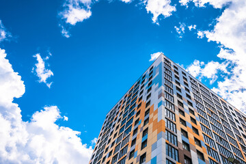 Fototapeta premium Multi-storey residential modern house against the sky. Residential area.