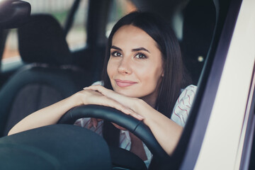 Close-up portrait of her she nice attractive lovely brunette pretty cute dreamy minded pensive cheery lady sitting in new car enjoying silence dreaming counting leasing credit loan finance insurance