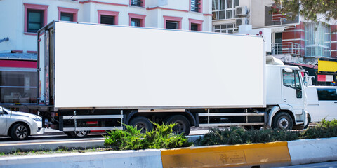 long cargo truck with empty white banner on bodywork commercial posting concept © Bonsales