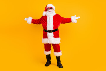 Fototapeta na wymiar Full length body size view of his he nice funny cheerful cheery positive white-haired Santa fooling having fun rest chill grimacing isolated bright vivid shine vibrant yellow color background