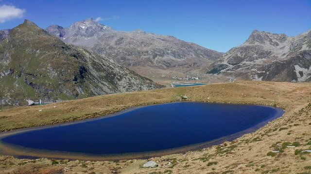 Aerial 4K - Montespluga, Italy, view of the lake towards the Swiss border