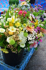 Colorful bouquet with summer flowers at the farmers market