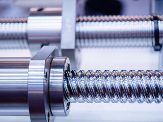 Steel rod with a screw thread and a metal round detail, in industrial applications.close-up.