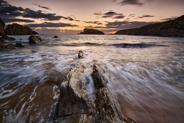 Landscape of an orange sunrise at Liencres beach © DAVID
