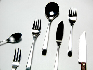 set of silver cutlery on white background