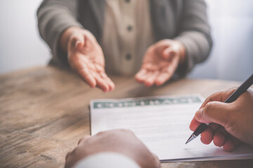 businessman is negotiating, advising, and explaining the matter of the contract to be agreed to sign the contract.