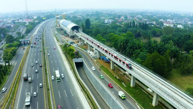 New LRT station with traffic on toll road